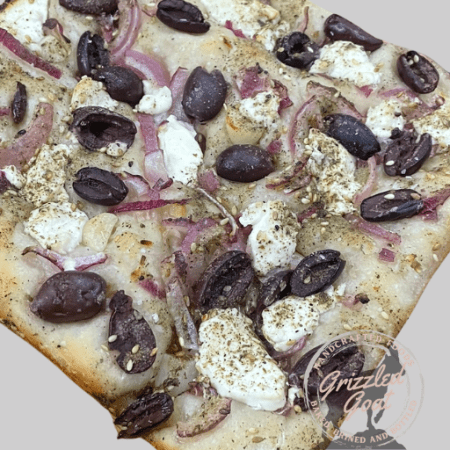 Middle Eastern Sourdough Focaccia with kalamata olives, goat cheese red onions and herbs Grizzled Goat